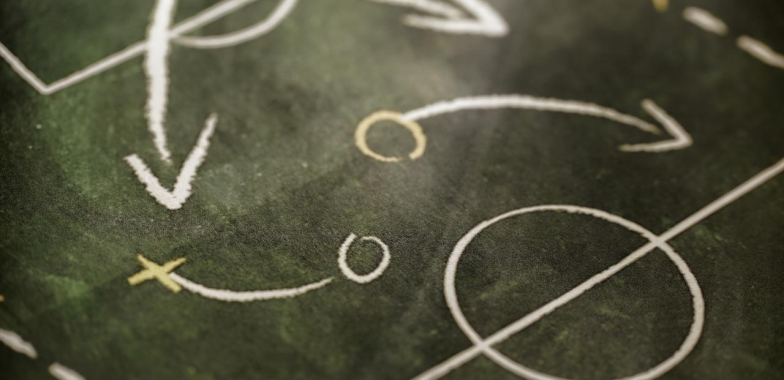 Chalk markings of tactics on a playing field