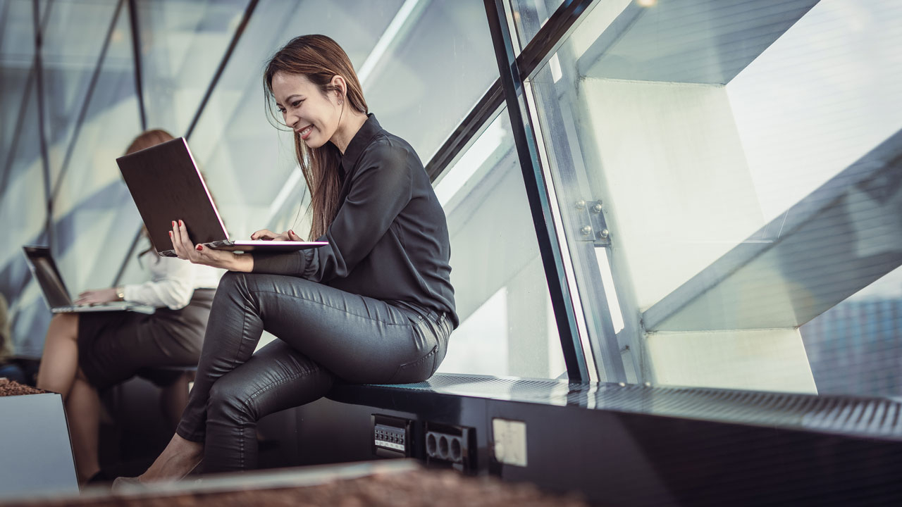 Woman with laptop at airport