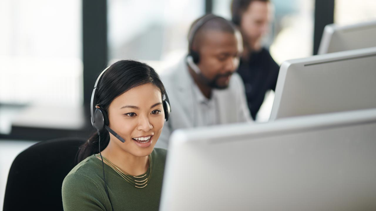 Female call centre worker smiling