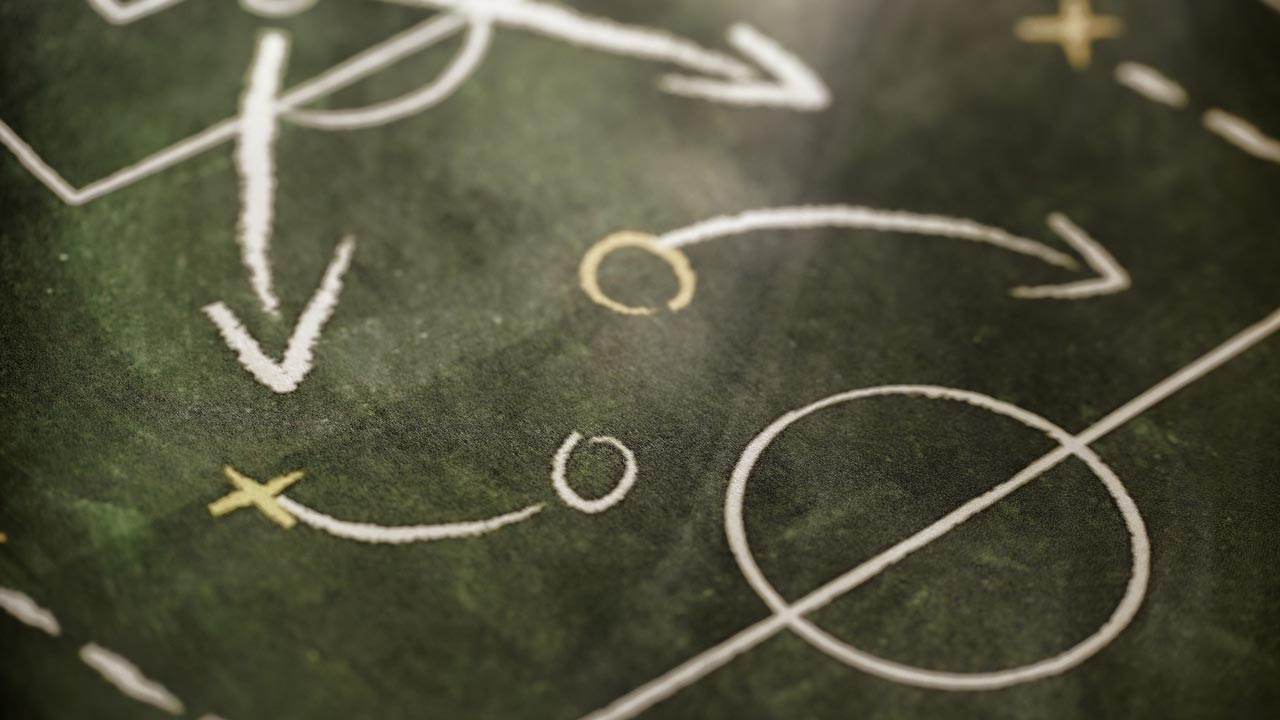 Chalk markings of tactics on a playing field