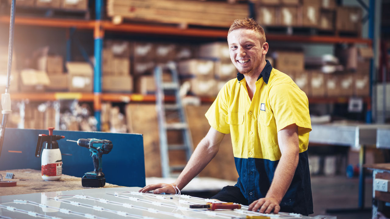 Smiling man in warehouse