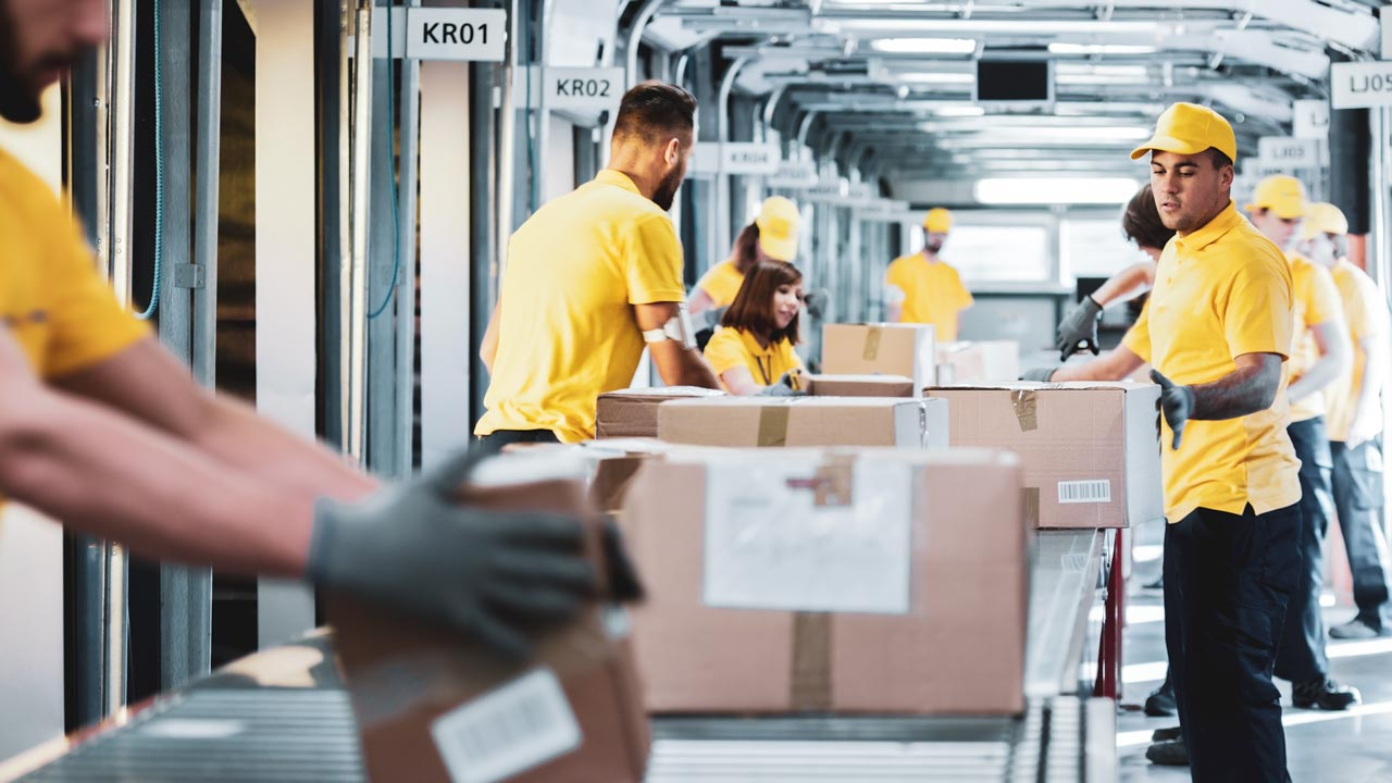 People working on a conveyor belt of parcels